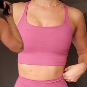 Alphalete surface elevation sports bra in candy apple